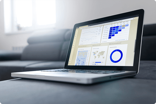 Laptop showing cloud financial reporting dashboards